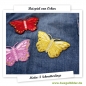 Schmetterlinge auf einem Jeansstoff für kleine Löcher.
