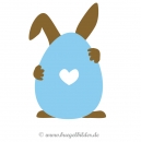 Bügelmotiv: Osterhase versteckt sich hinter einem bunten Osterei.